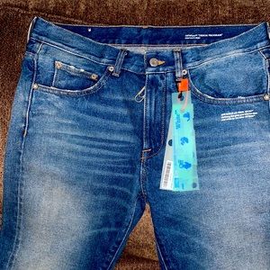 Off-White tm “Denim Program” jeans.